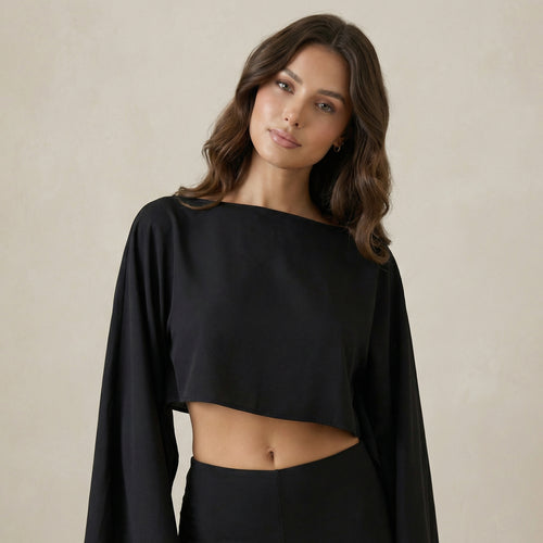 Black Top with Asymmetric Neck and Cape Sleeve Detail